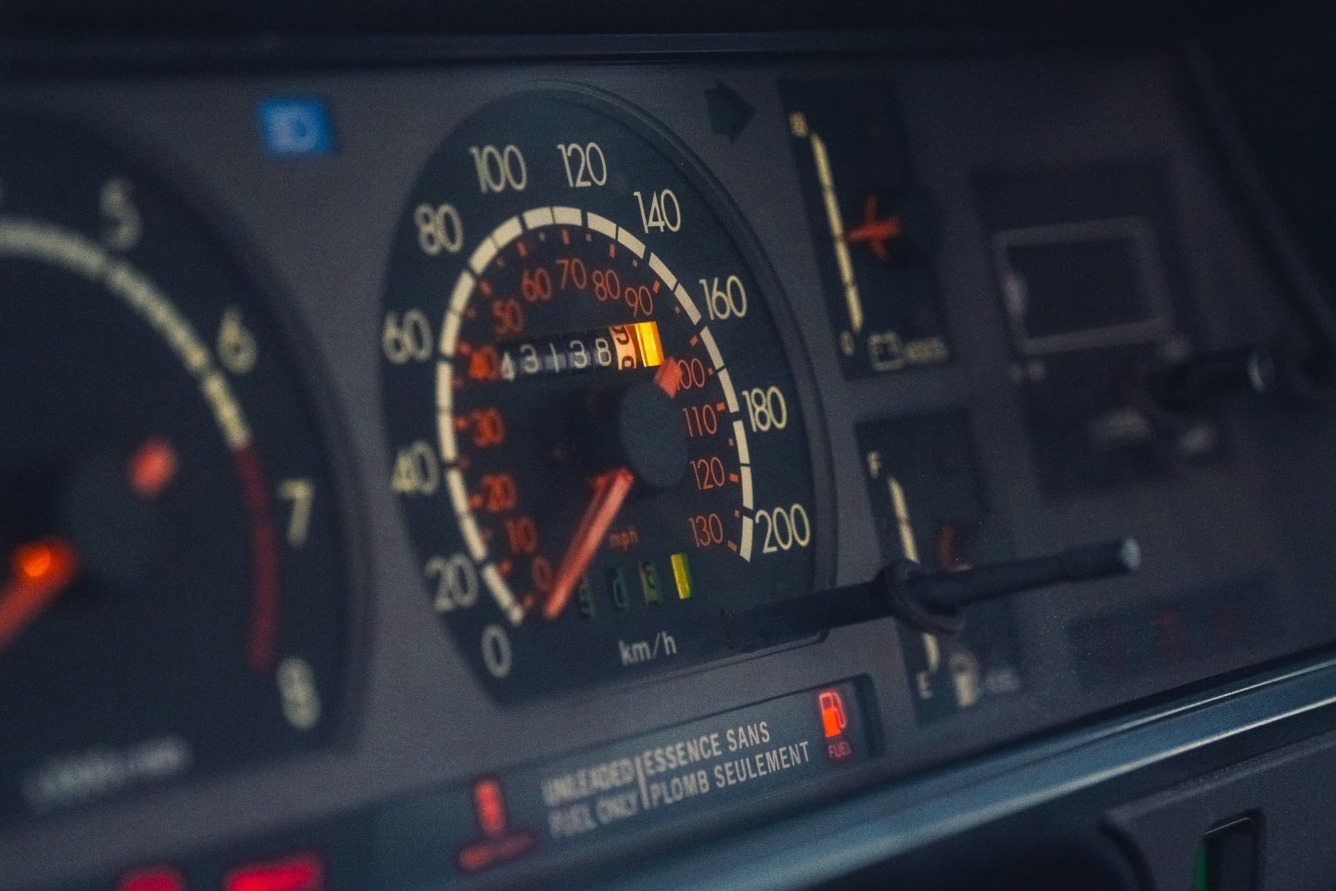 Vehicle odometer and speedometer: tracking mileage vs engine hours Close-up of vehicle dashboard speedometer and odometer showing mileage